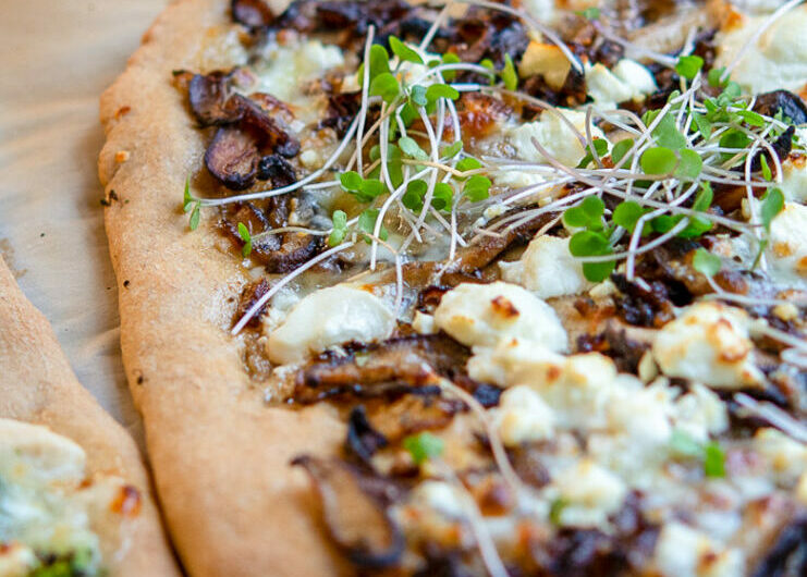 This wild mushroom pizza has caramelized onions, and crazy flavorful fontina cheese, and is a bit indulgent, (um, butter), and takes a little time to prepare (but all prep can be done ahead of time), and totally worth it!